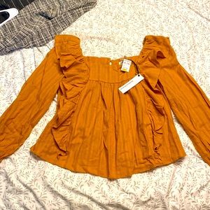 Mustard color. Brand new with tags. Cavenders blouse.